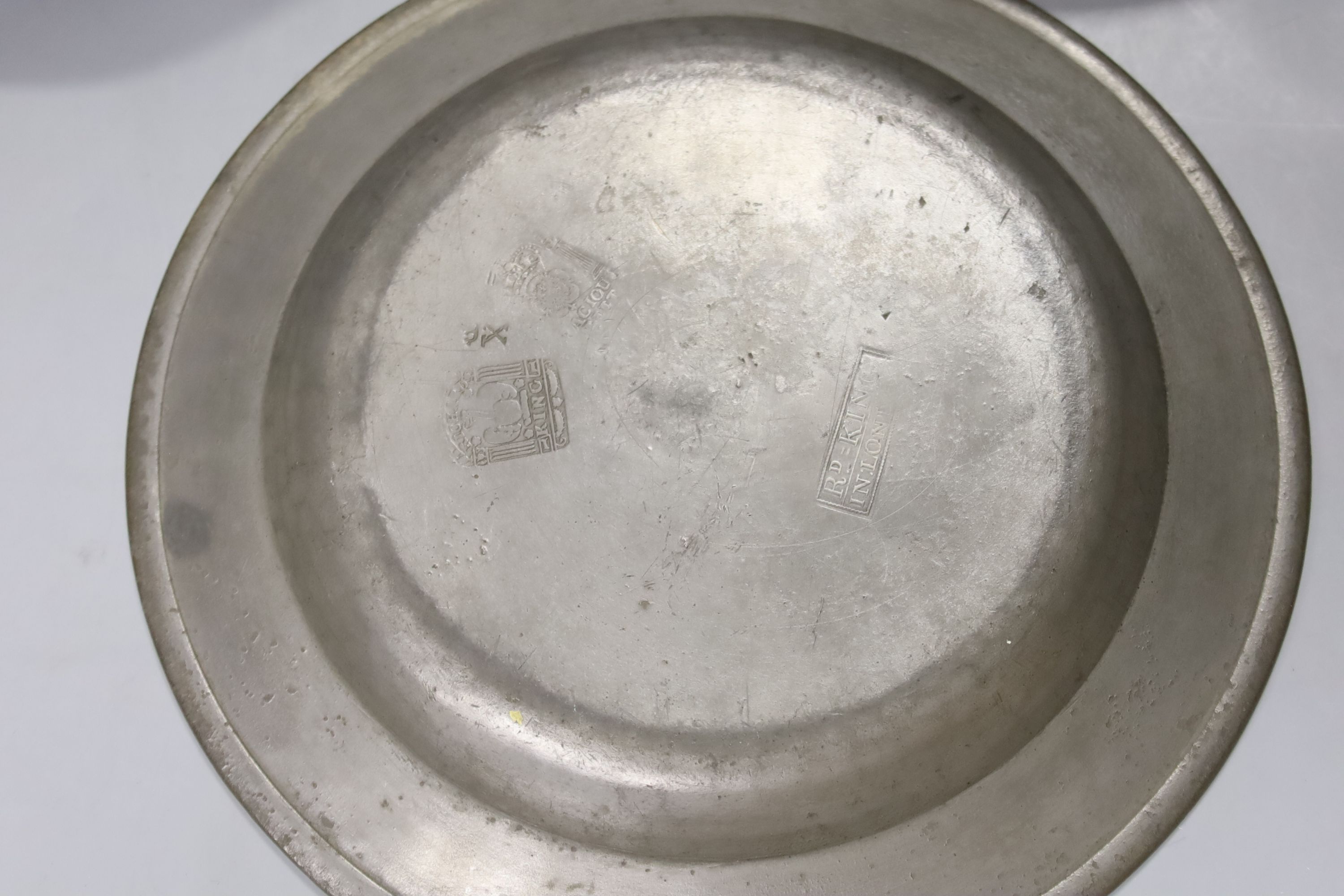 A quantity of 18th century pewter plates, London touch marks diameter 24cm